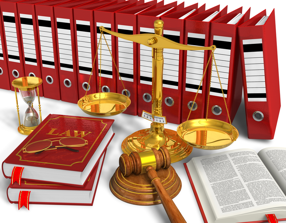 Legal books, scale, and gavel on a table at a Lakeway TX Law Firm